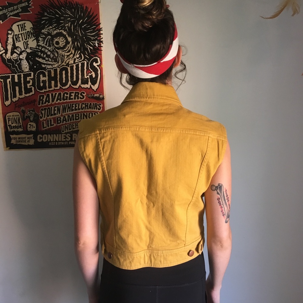 Women’s yellow denim vest.